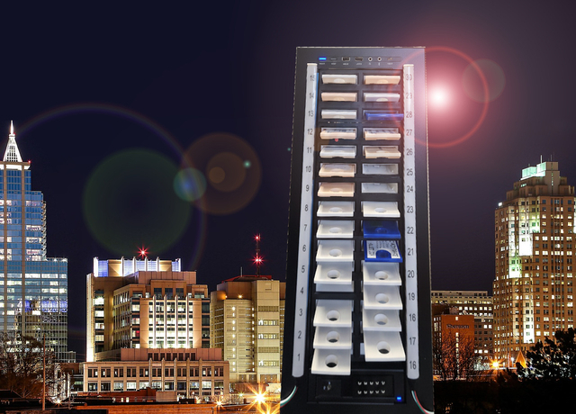 A cheesy PhotoShopped image of a large, 30-cartridge-slot scribe tower looming over the Raleigh skyline, complete with lens flare.